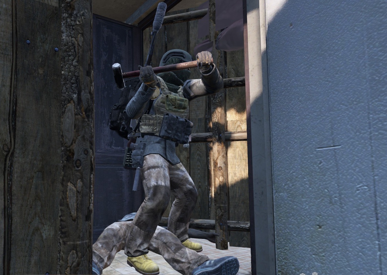 DayZ survivor using a raid hammer to breach a base